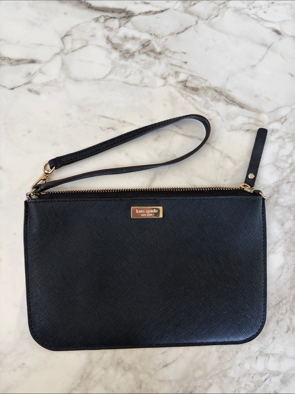 Authentic Kate Spade black leather wristlet with gold-tone hardware